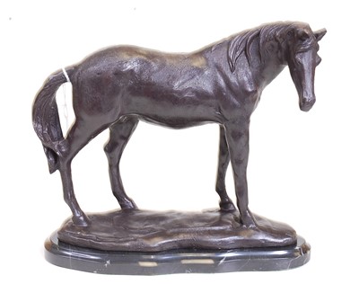 Lot 58 - A bronze model of a horse, shown in standing...