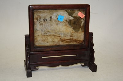 Lot 63 - A Chinese hardwood and polished green...