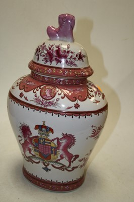 Lot 110 - A pair of reproduction armorial jars and...