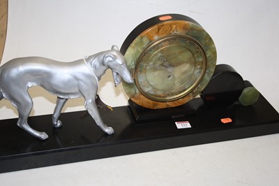 Lot 113 - A 1930s Art Deco mantel clock, the onyx dial...