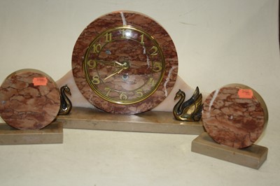 Lot 124 - A 1930s Art Deco mantel clock garniture, the...