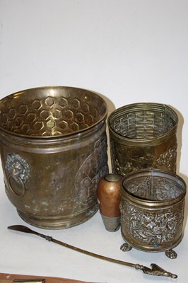 Lot 138 - A 20th century repoussee decorated brass coal...