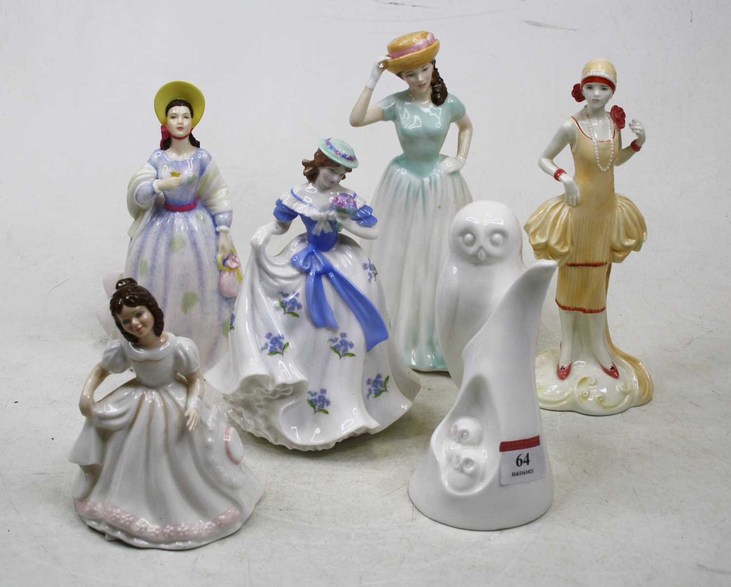 Lot 64 - A collection of porcelain figures, to include...