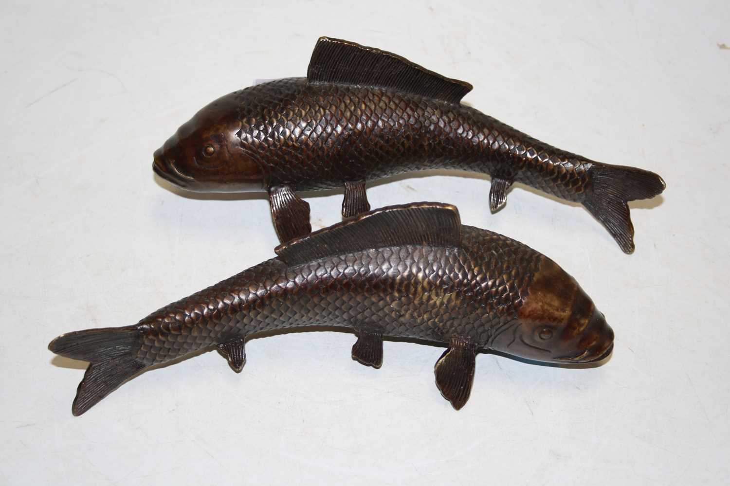 Lot 267 - A pair of modern bronzed metal figures of koi...