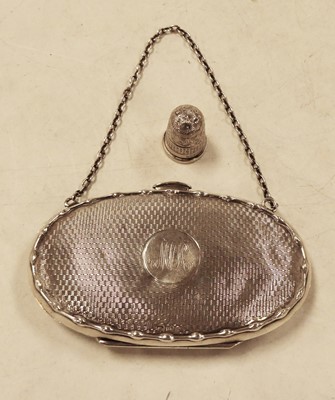 Lot 272 - A George V silver ladies purse of oval form...