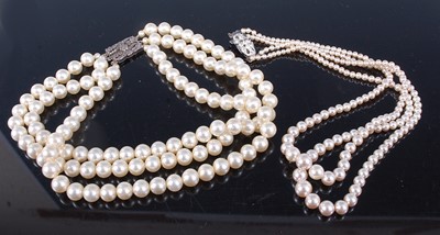 Lot 387 - A 1950s Rosita faux pearl double string...