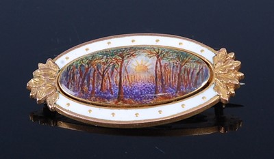 Lot 2635 - A 9ct yellow gold and enamel oval brooch,...