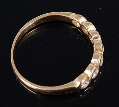 Lot 2700 - A contemporary 18ct gold diamond half hoop...