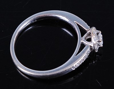 Lot 2706 - A 9ct white gold diamond dress ring, arranged...
