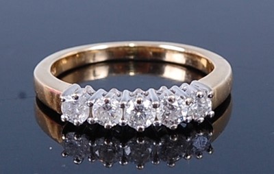 Lot 2709 - An 18ct gold and diamond half hoop ring...