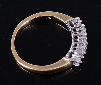 Lot 2709 - An 18ct gold and diamond half hoop ring...