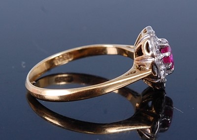 Lot 2713 - A vintage 18ct gold ruby and diamond flower...