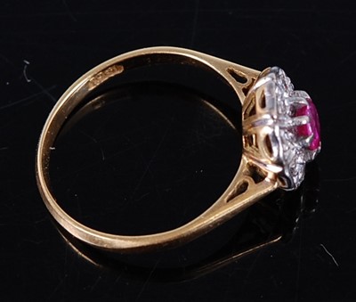 Lot 2713 - A vintage 18ct gold ruby and diamond flower...
