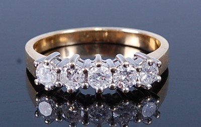 Lot 2714 - An 18ct gold diamond half hoop ring, arranged...