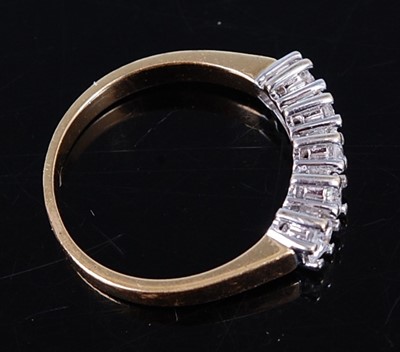 Lot 2714 - An 18ct gold diamond half hoop ring, arranged...