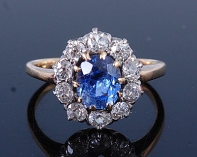 Lot 2649 - A yellow and white metal, sapphire and diamond...