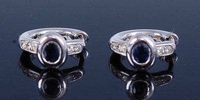 Lot 2715 - A pair of white metal, sapphire and diamond...