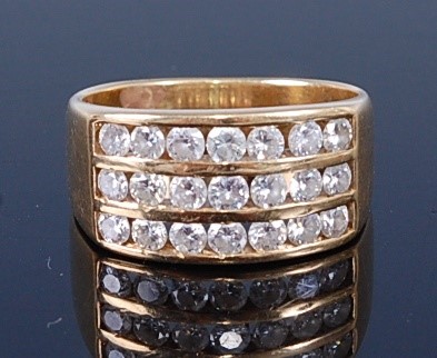 Lot 2661 - An 18ct gold diamond dress ring, arranged as...