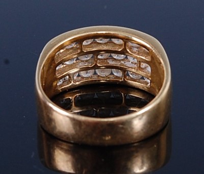 Lot 2661 - An 18ct gold diamond dress ring, arranged as...