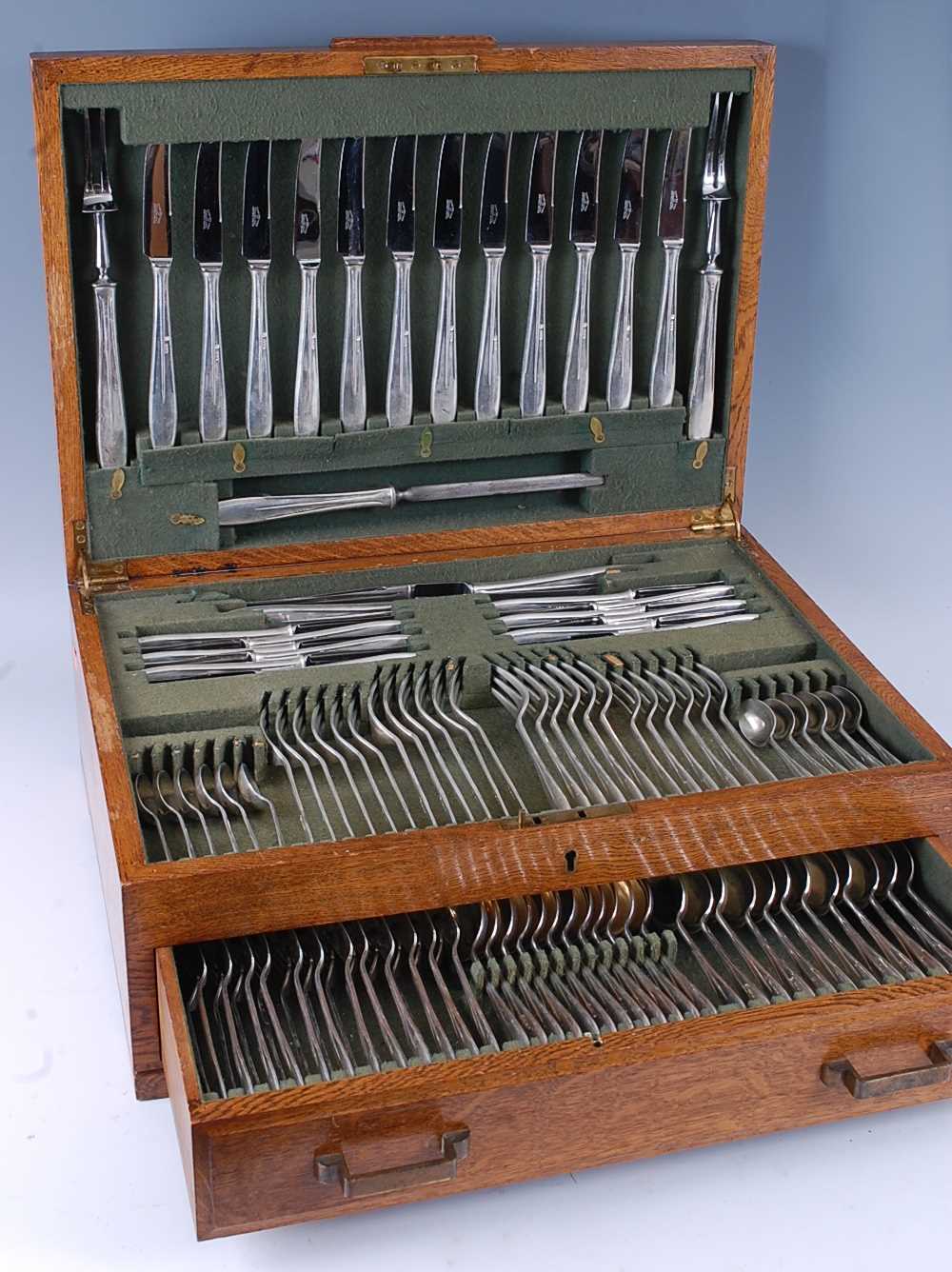 Lot 2144 - A 1930s oak cased fitted canteen of cutlery,...
