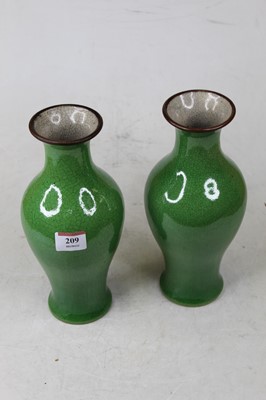 Lot 209 - A pair of Chinese green ground crackle glaze...