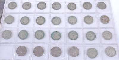 Lot 2177 - Great Britain, a folder of coins to include...