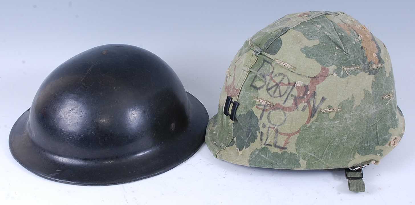 Lot 25 - A British ARP type helmet, having a leather...