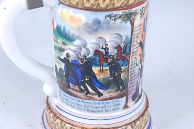 Lot 128 - A German porcelain beerstein, painted and...