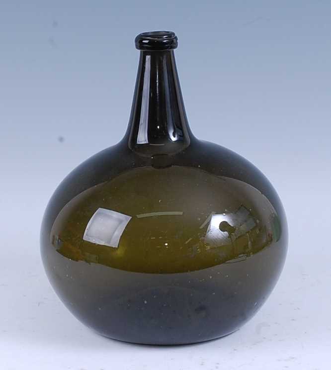 Lot 2241 - * An early 18th century brown glass wine...