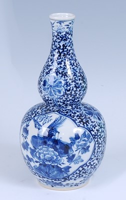 Lot 2451 - A Chinese export blue and white double gourd...