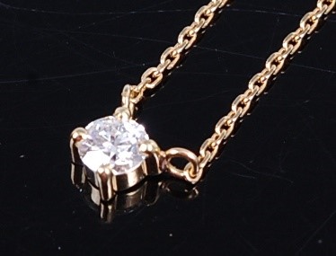 Lot 2672 - A yellow metal diamond single stone pendant,...