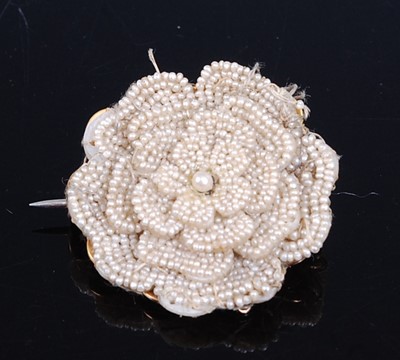 Lot 2675 - A yellow metal multi-seed pearl rose shaped...