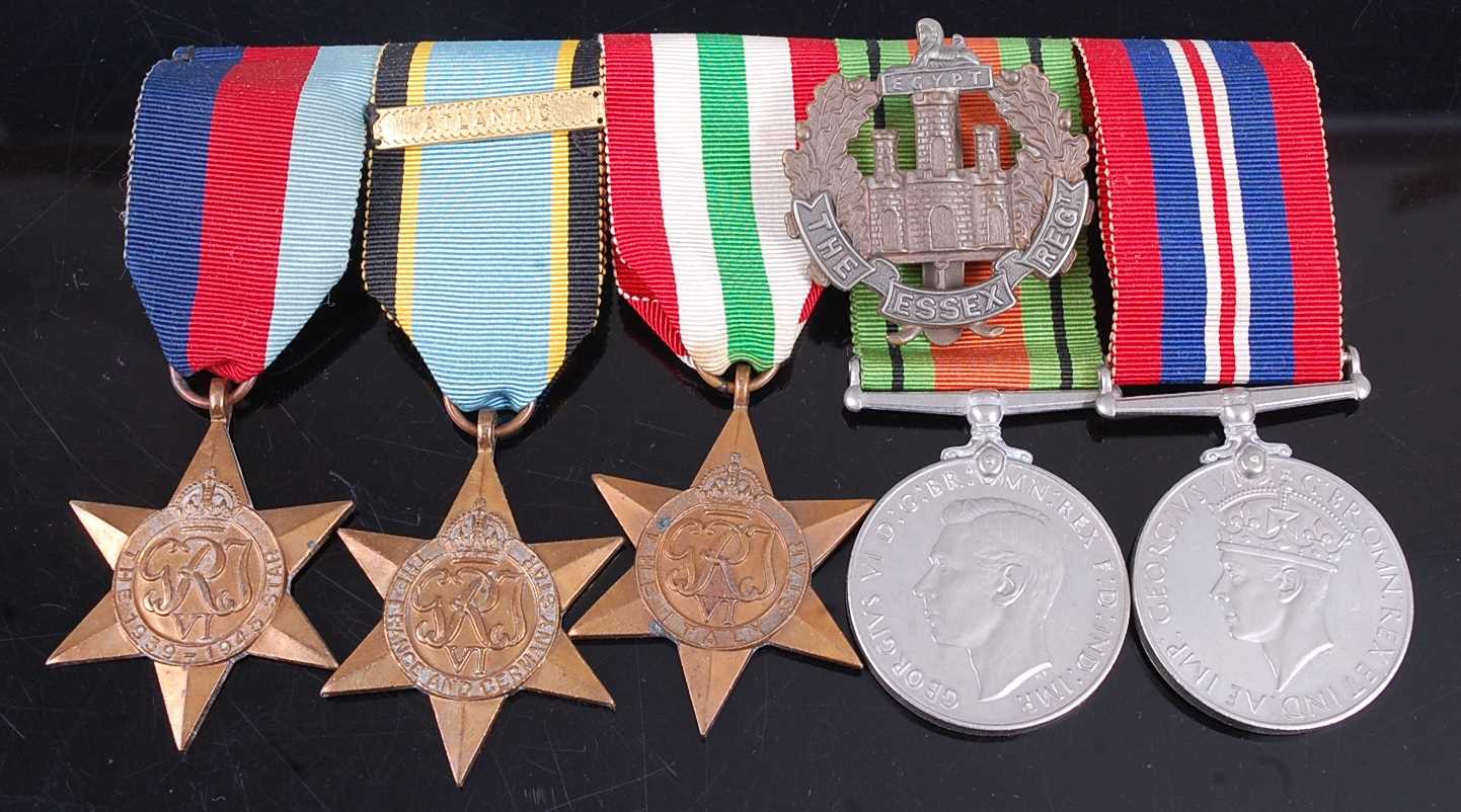 Lot 110 - A group of five WW II medals, to include...