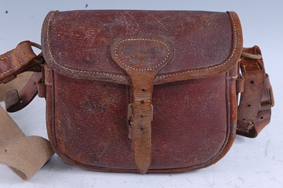 Lot 283 - A brown stitched leather cartridge bag, naming...