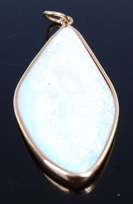 Lot 2680 - A yellow metal and opal set pendant, the slice...