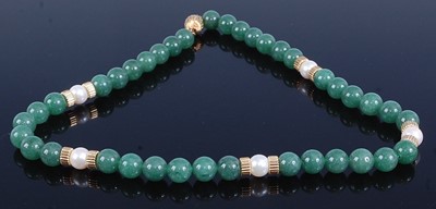 Lot 2681 - A beaded nephrite, cultured pearl and yellow...