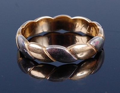 Lot 2686 - An 18ct two-colour gold wedding band, 3.9g,...