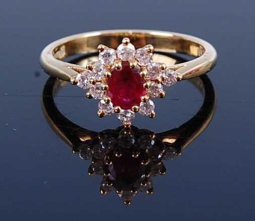 Lot 2688 - An 18ct gold, ruby and diamond flower head...