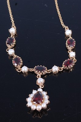 Lot 2689 - A 9ct gold, garnet and seed pearl set necklace,...