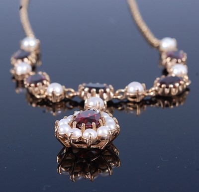 Lot 2689 - A 9ct gold, garnet and seed pearl set necklace,...