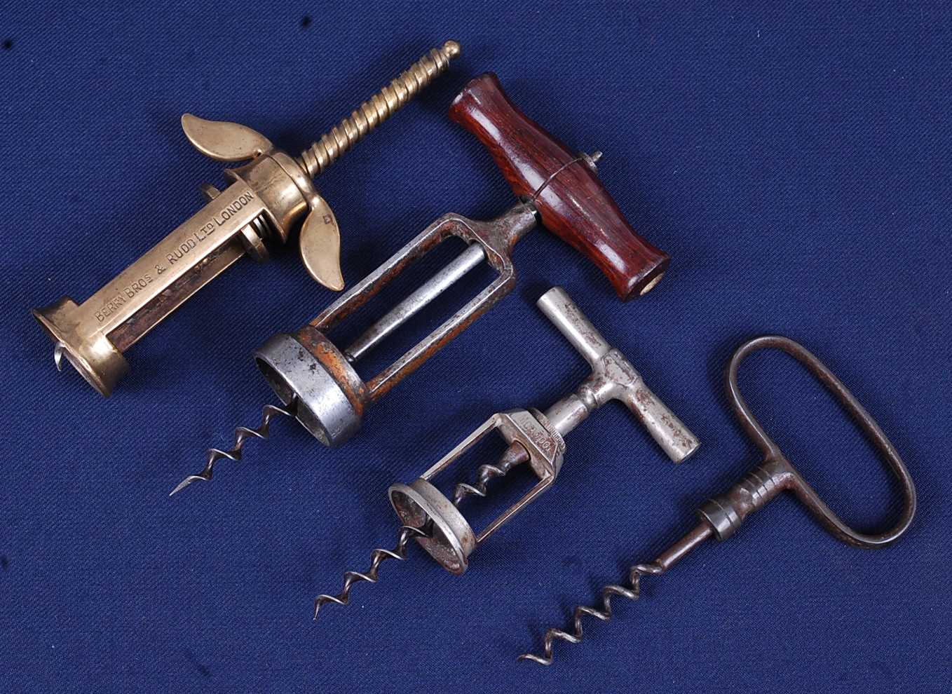 Lot 2283 - An early 20th century brass corkscrew, having...