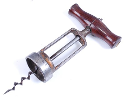 Lot 2283 - An early 20th century brass corkscrew, having...