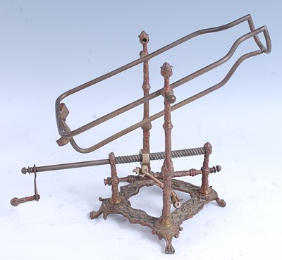 Lot 2229 - * A late 19th century brass bottle cradle, the...