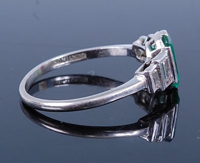 Lot 2747 - A white metal, emerald and diamond Art Deco...