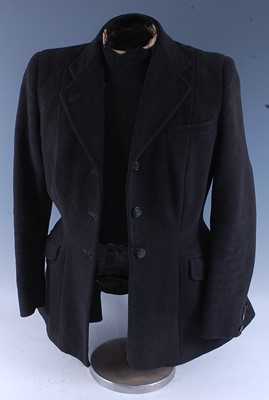Lot 273 - A ladies hunt coat in black Melton cloth,...