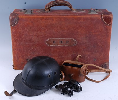 Lot 281 - A brown stitched leather case bearing the...
