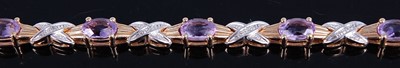 Lot 2761 - A yellow and white metal amethyst line...