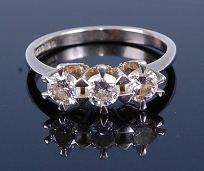Lot 2766 - An 18ct white gold diamond trilogy ring,...