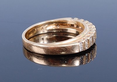 Lot 2768 - A modern 18ct gold diamond half hoop ring,...