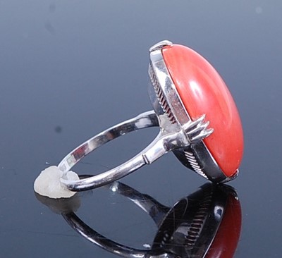 Lot 2781 - A continental white metal coral set dress ring,...